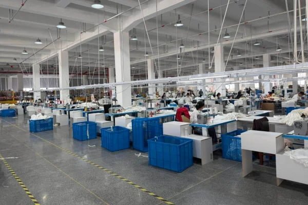 Inside our BSCI and SMETA certified custom gym bag factory featuring 40 heavy-duty sewing machines and clean production lines.